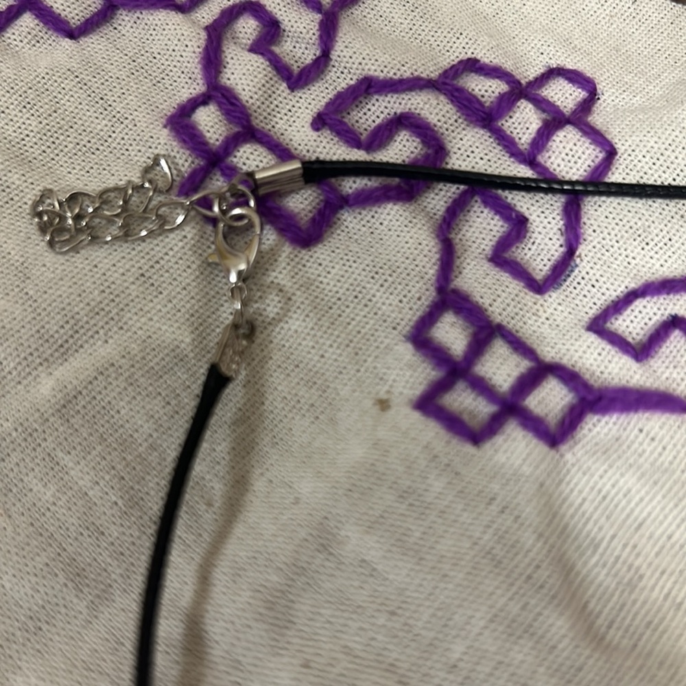 This black stone with white swirls is highly blessed - Picture 3 of 3